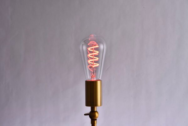 The ST64 Retro LED Bulb features colored lights, including a filament and Edison's creative red, yellow, blue, green, and pink colors.