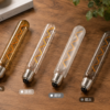 LED filament bulb lifestyle interior lighting display on wooden table warm ambient scene